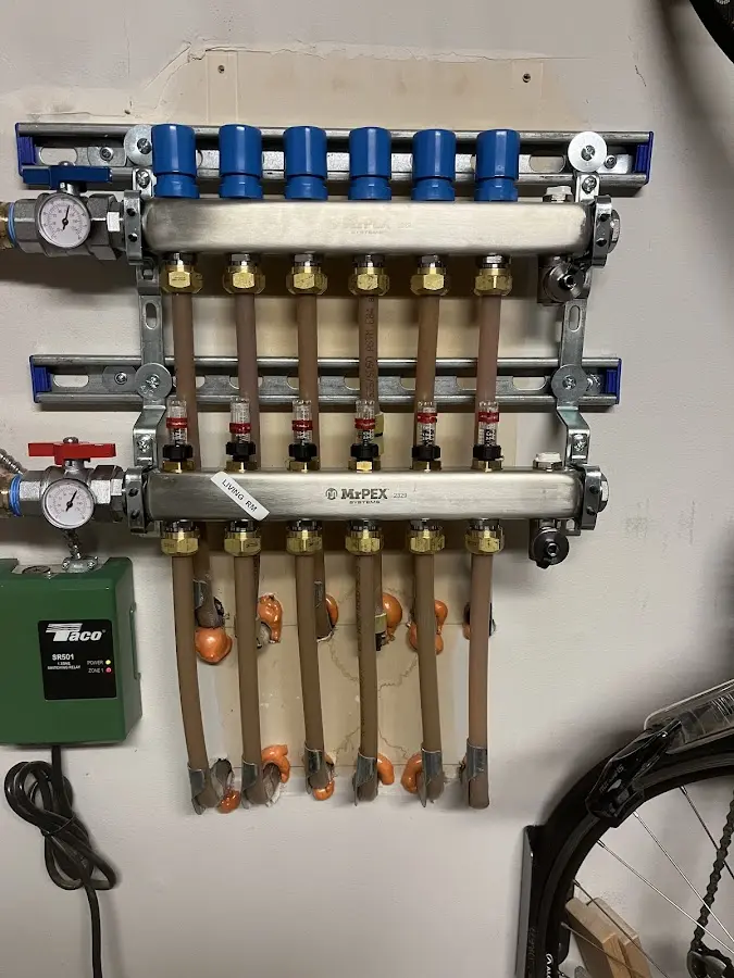 Plumber performing Water Heater Repair at a residential property in Ellsworth